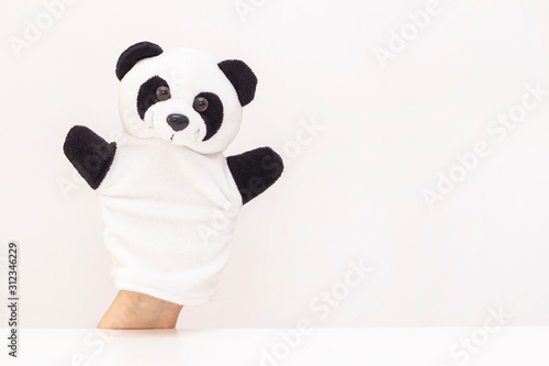 puppet theater on a white background. friendly animals hold hands. The concept of playing with children, friendship, family, entertainment. Nanny entertains children. copyspace