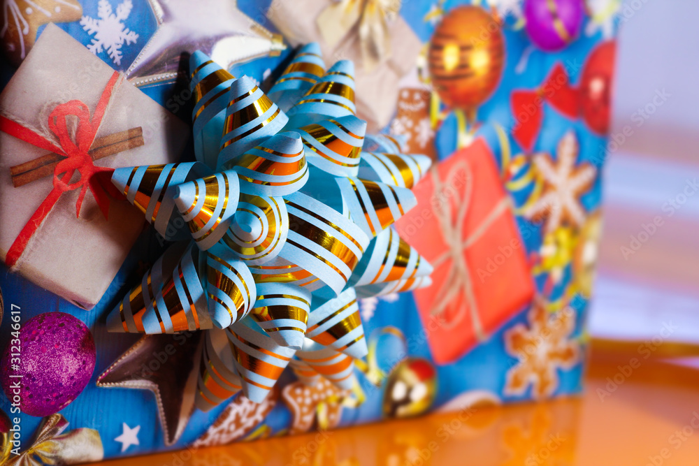 Bow on the gift blue with gold stripes for the background