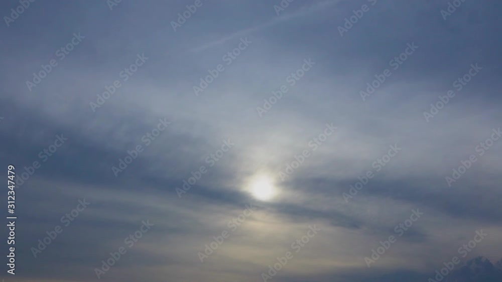 Beautiful cloudscape of cloudy sky and misty sun hiding behind soft transparent clouds. Video timelapse of beautiful heaven. Beautiful cloudscape of cloudy sky and misty sun hiding behind soft transparent clouds. Video timelapse of beautiful heaven.