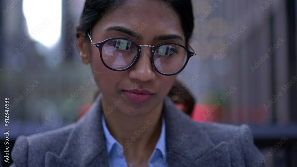 Experienced financial expert checking information on corporate website via modern touch pad connected to 4g wireless, digital tablet screen reflected in optical glasses for vision protection