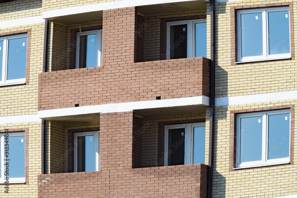 Balconies and windows of a multi-storey new house Balconies and windows of a multi-storey new house