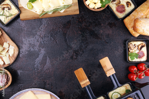 Canvas Print Delicious traditional Swiss melted raclette cheese on diced boiled or baked potato