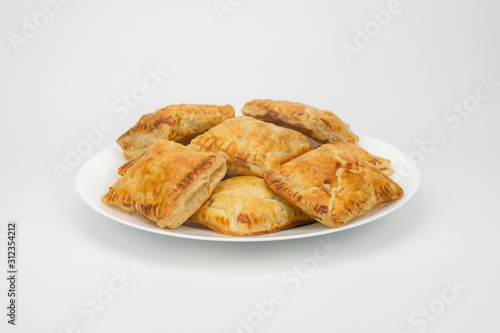 Guava puff pastry on a plate isolated in white background