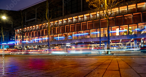 Schouwburgplein in Rotterdam by night with lightstreaks of a policecar photo