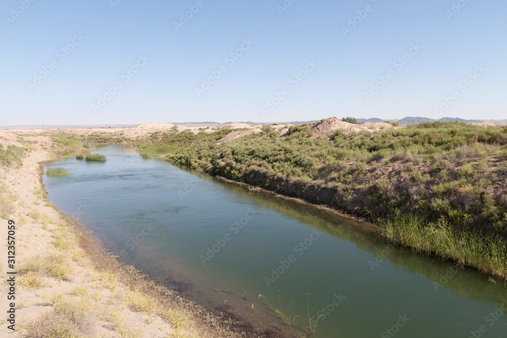 An irrigation channel near the Kyzyl Qala fortress (Uzbekistan) An irrigation channel near the Kyzyl Qala fortress (Uzbekistan)