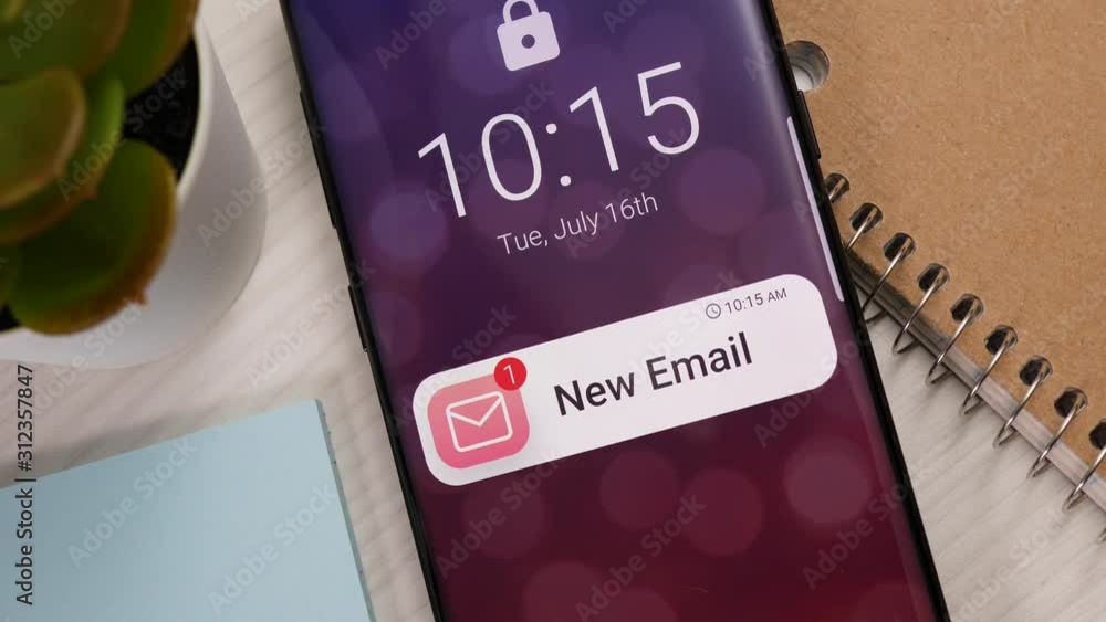 Smartphone showing a new message notification banner appearing on the ...