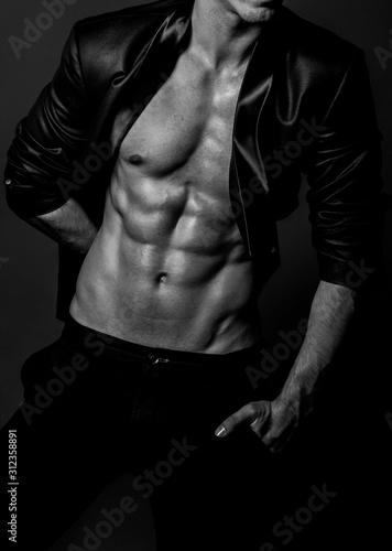 Muscular fit male body , black and white photo 