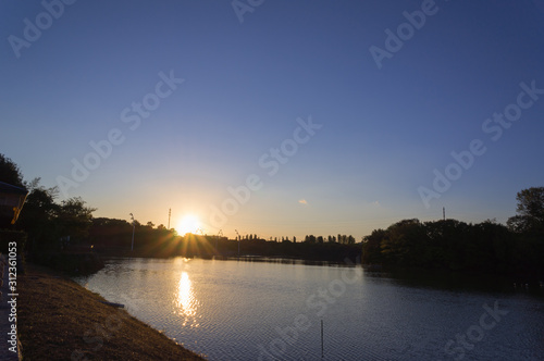 Sunset reflected in the lake, Flower Expo Memorial Tsurumi Ryokuchi Park. photo