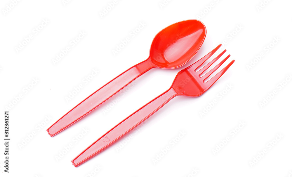 Red plastic fork and spoon isolated on white Red plastic fork and spoon isolated on white