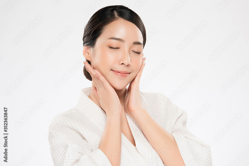 Beautiful Young Asian Woman with Clean Fresh Skin. Face care, Facial treatment, on white background, Beauty and Cosmetics Concept. Beautiful Young Asian Woman with Clean Fresh Skin. Face care, Facial treatment, on white background, Beauty and Cosmetics Concept.