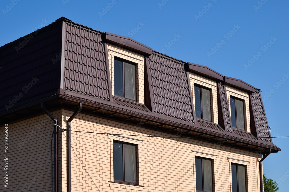 The house with plastic windows and a roof of corrugated sheet The house with plastic windows and a roof of corrugated sheet