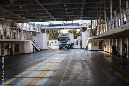 Fotografia A truck moving into a ferry.