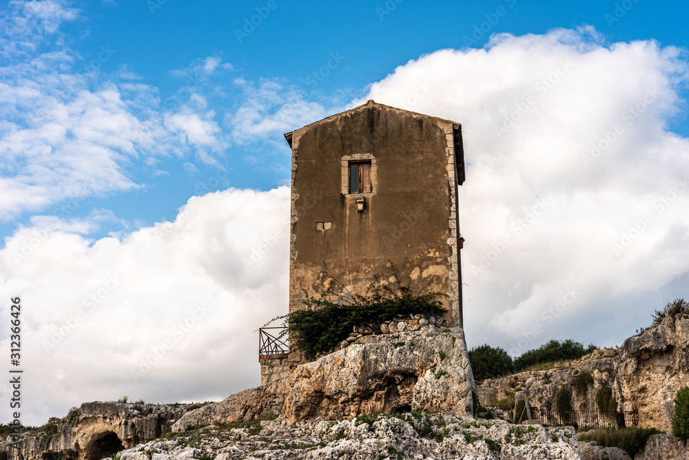  old stone building in the Greek theater of Syracuse