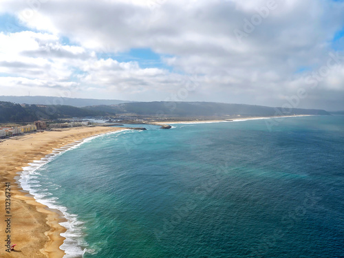 Wonderful aerial view of beach and waves at Nazare in Portugal © Stimmungsbilder1