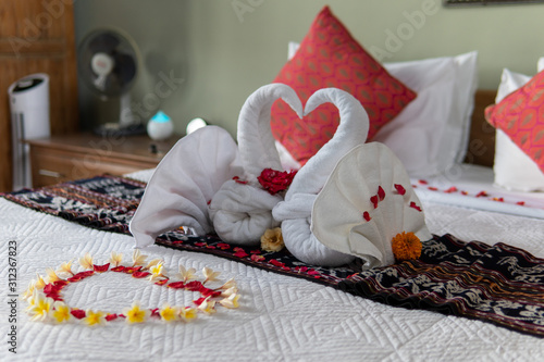 Two Towel Swans with Flowers photo