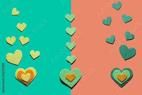 Felt hearts on the green and otrange background. St. Valentine's day