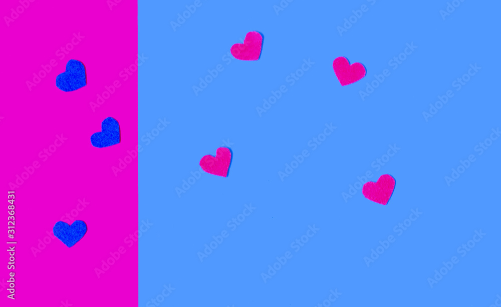 Blue and pink hearts on the colotful background. Copy space. Place for text and design Blue and pink hearts on the colotful background. Copy space. Place for text and design