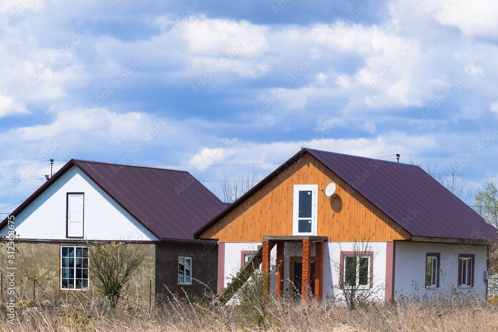 The roof of corrugated sheet on the houses The roof of corrugated sheet on the houses