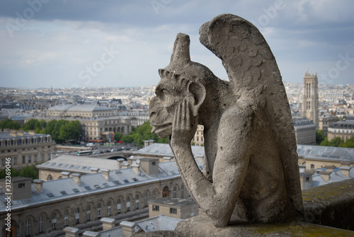 Gargoyle thinking on top of Notre Dame