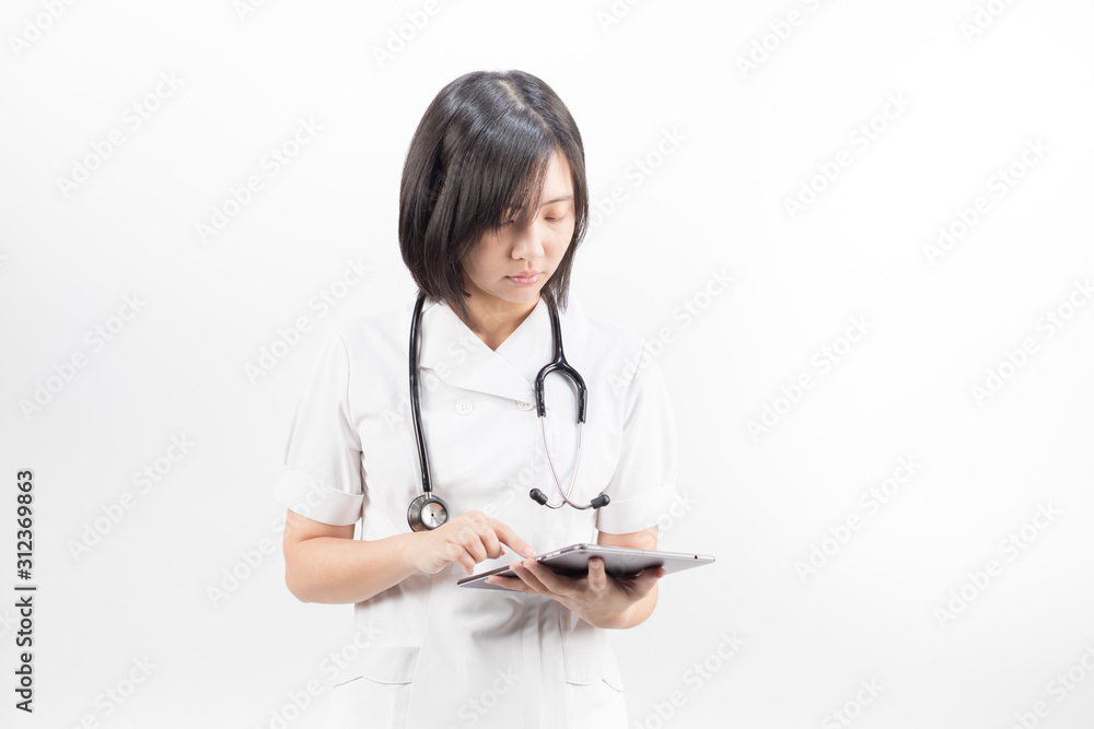 Young asian nurse with a stethoscope using a digital tablet, isolated over white background. Young asian nurse with a stethoscope using a digital tablet, isolated over white background.