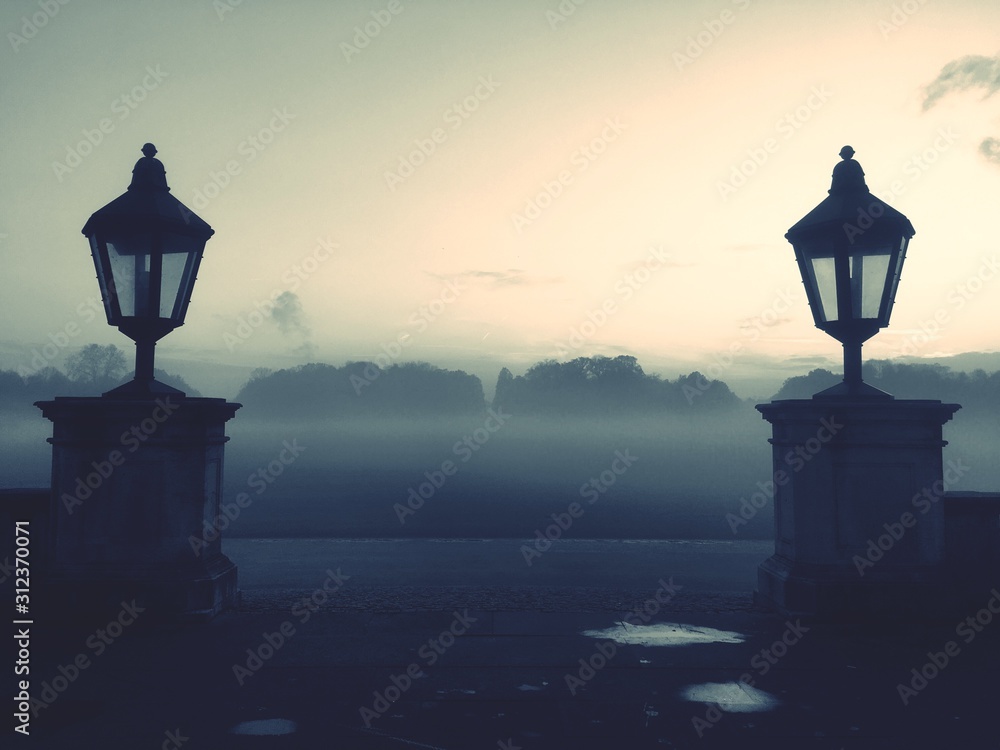 silhouette of a lamp at sunset