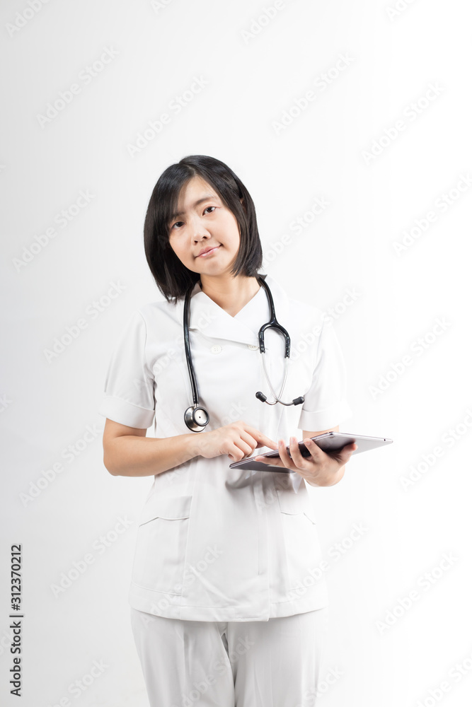 Young asian nurse with a stethoscope using a digital tablet, isolated over white background. Young asian nurse with a stethoscope using a digital tablet, isolated over white background.