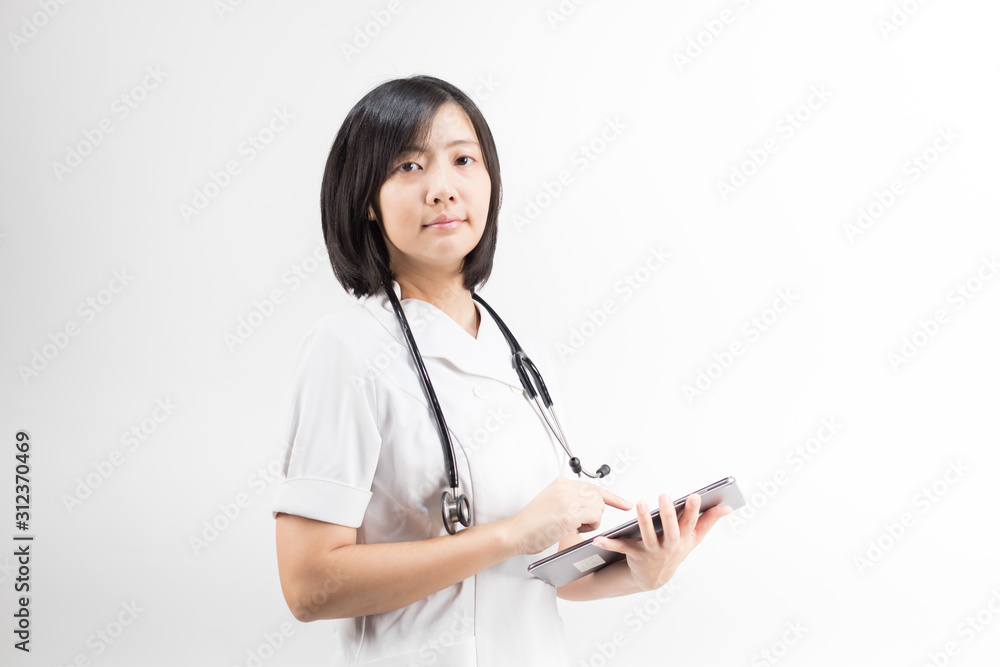 Young asian nurse with a stethoscope using a digital tablet, isolated over white background.