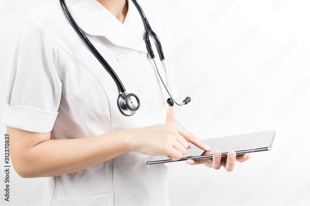 Young asian nurse with a stethoscope using a digital tablet, isolated over white background. Young asian nurse with a stethoscope using a digital tablet, isolated over white background.