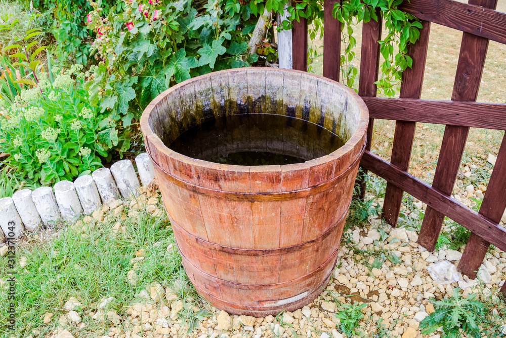 Wooden barrel filled with water