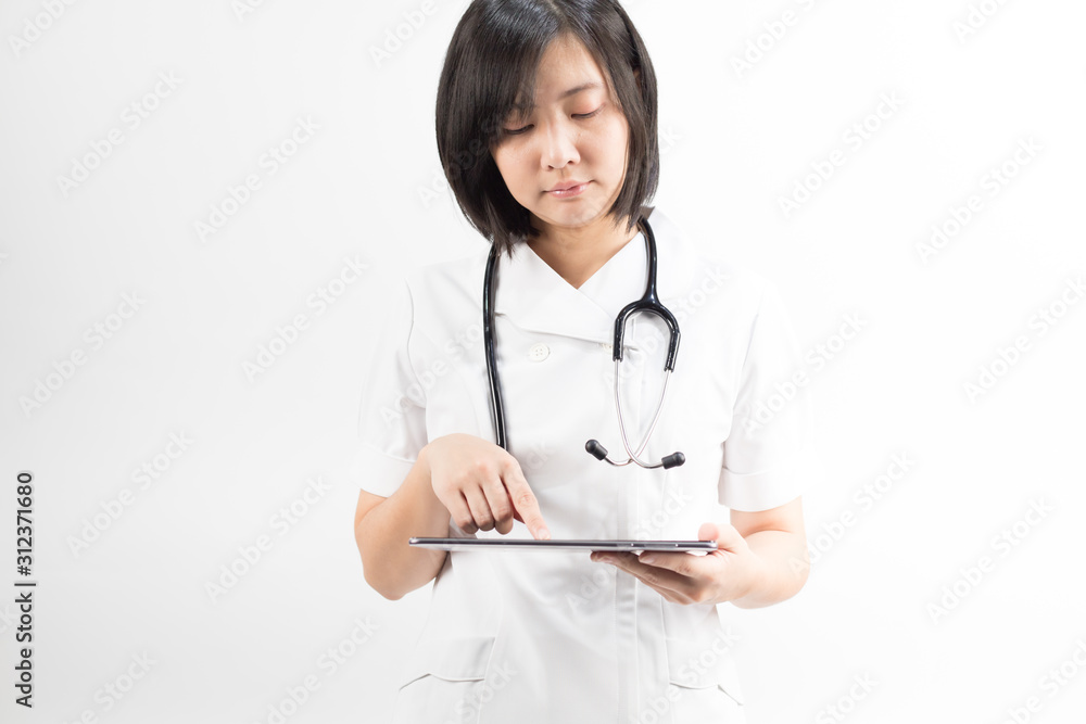 Young asian nurse with a stethoscope using a digital tablet, isolated over white background. Young asian nurse with a stethoscope using a digital tablet, isolated over white background.