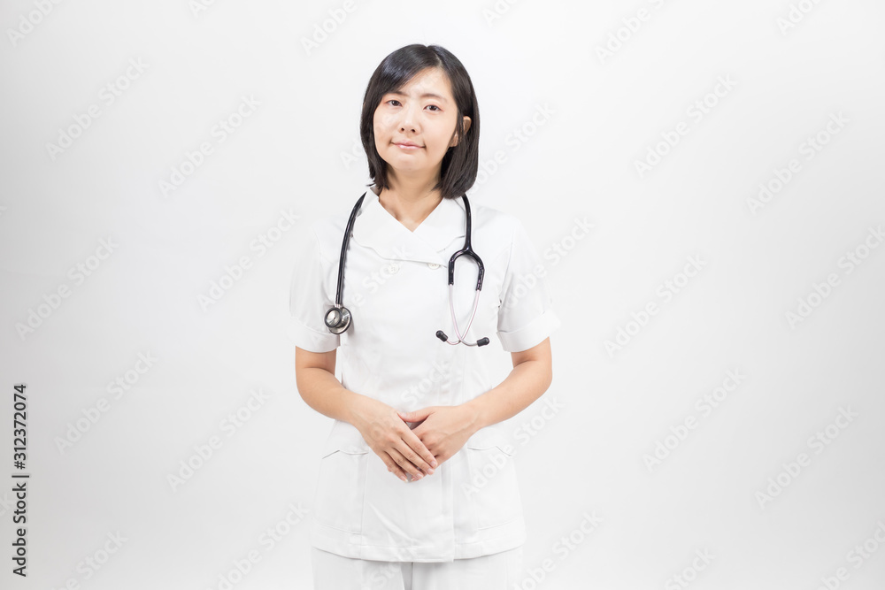 Young asian nurse with a stethoscope isolated over white background. Young asian nurse with a stethoscope isolated over white background.