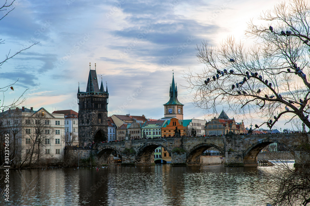 View of Charles Bridge in the Czech Republic in Prague on the Vltava River in winter.