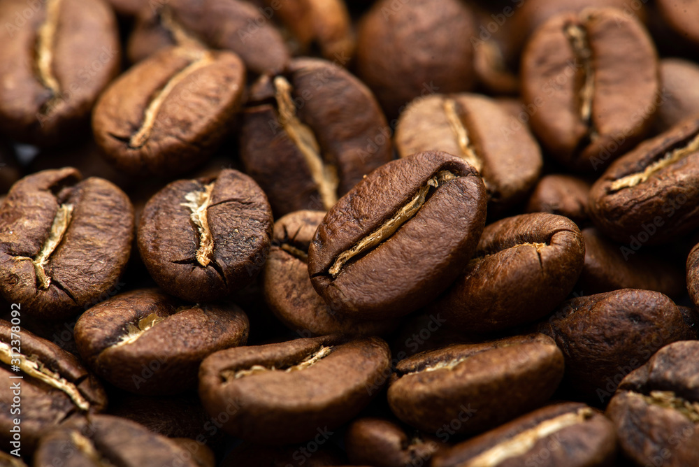 Fototapeta premium Coffee beans close-up background. Fresh roasted