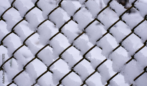 background mesh made of metal wire with snow