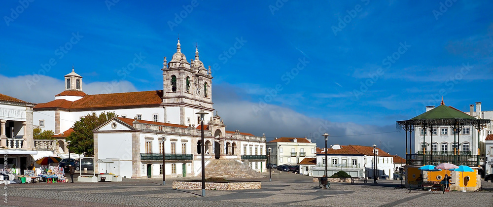 Fototapeta premium City church of Nazare named Nossa Senhora at the Atlantic ocean coast of Portugal