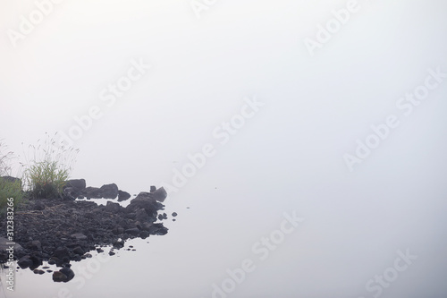 Fototapeta Naklejka Na Ścianę i Meble -  Fog in the lake. Morning nature water white fog.
