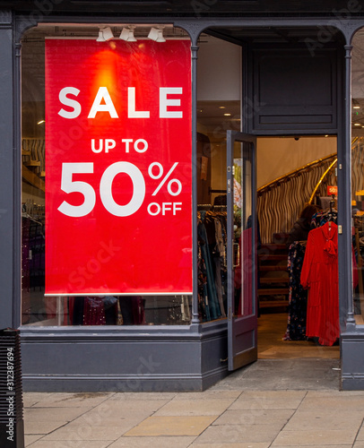 sale sign in shop boutique window