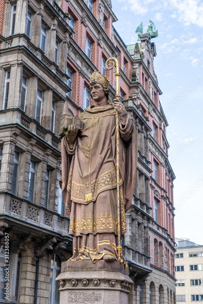 The historic bishop Ansgar statue on Trostbrucke bridge in Hamburg, Germany