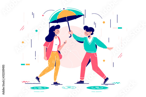 Young handsome man protects attractive woman from rain. photo
