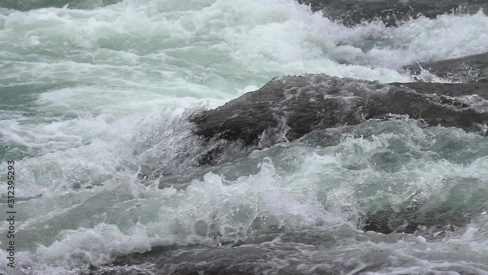 Gullfoss waterfall in Iceland, slow motion from 120 fps, detail water crushing down with immense untameable force Gullfoss waterfall in Iceland, slow motion from 120 fps, detail water crushing down with immense untameable force