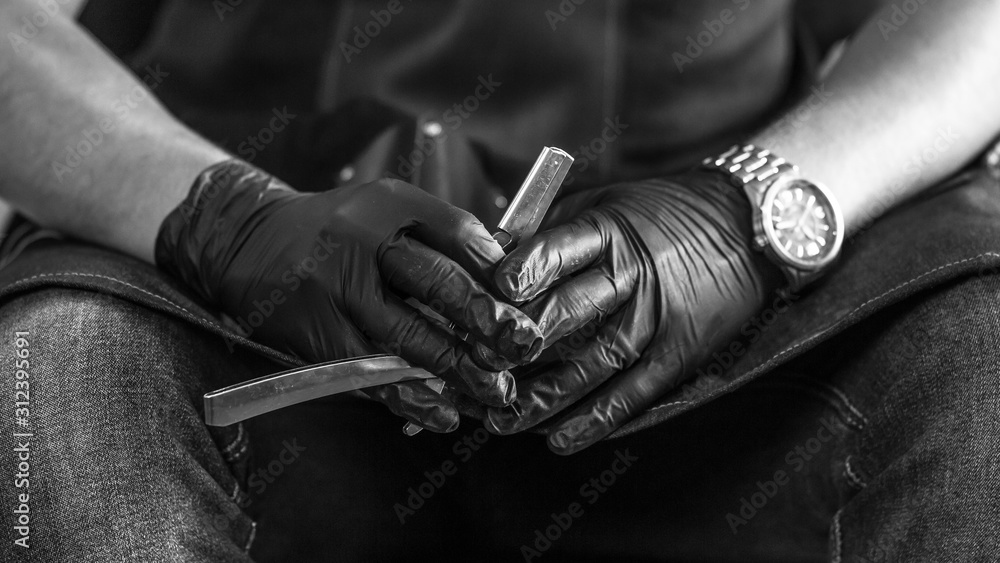 Fototapeta premium Concept Barber in a stylish vintage barber shop with his tools