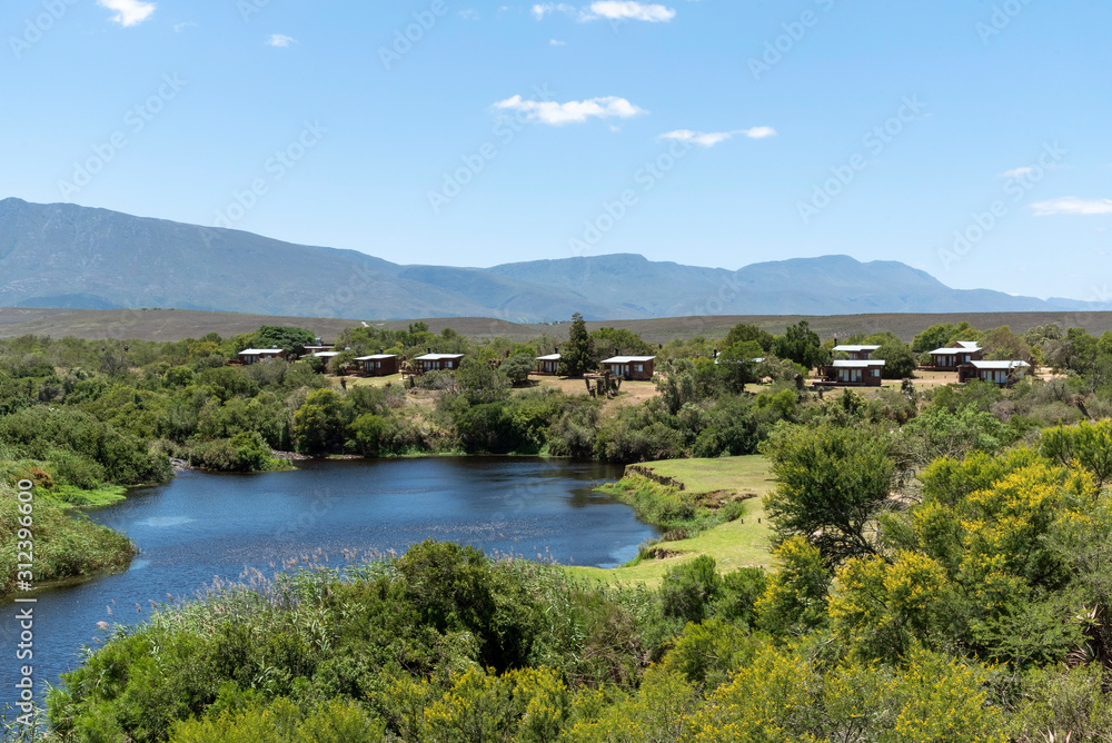 Swellendam, Western Cape, South Africa, December 2019. Campsite on the Breede River viewd from Aloe Hill on the Garden Route.