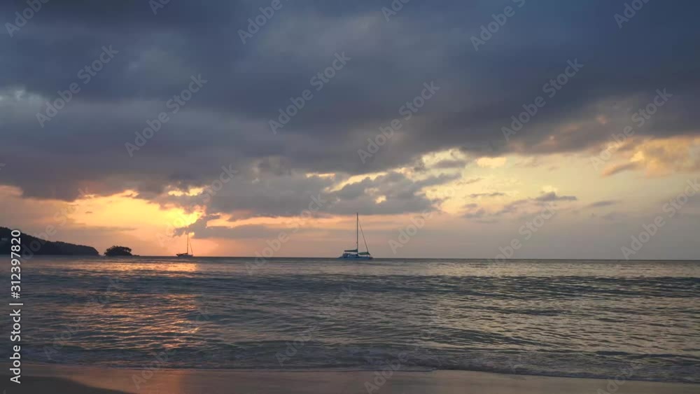 Red orange sunset sky orange and sailboat video 4k cloud Red orange cloudscape time lapse background Dark red purple sunset sky cloud time lapse 4k evening clouds moving away rolling Phuket Thailnad. Red orange sunset sky orange and sailboat video 4k cloud Red orange cloudscape time lapse background Dark red purple sunset sky cloud time lapse 4k evening clouds moving away rolling Phuket Thailnad.