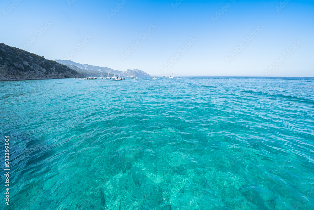 Fototapeta premium Clear azure coloured sea water, Sardinia, Italy