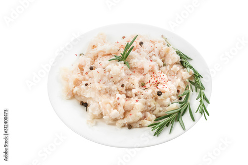 Photography Raw minced fish in a plate with herbs and spices isolated on white background
