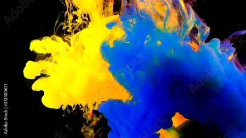 Color paint drops in water , abstract color mix , drop of Ink color mix paint falling on water Colorful ink in water, 4K footage,