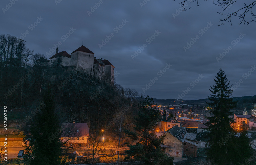 View over Vimperk town in winter dark cold evening with castle View over Vimperk town in winter dark cold evening with castle