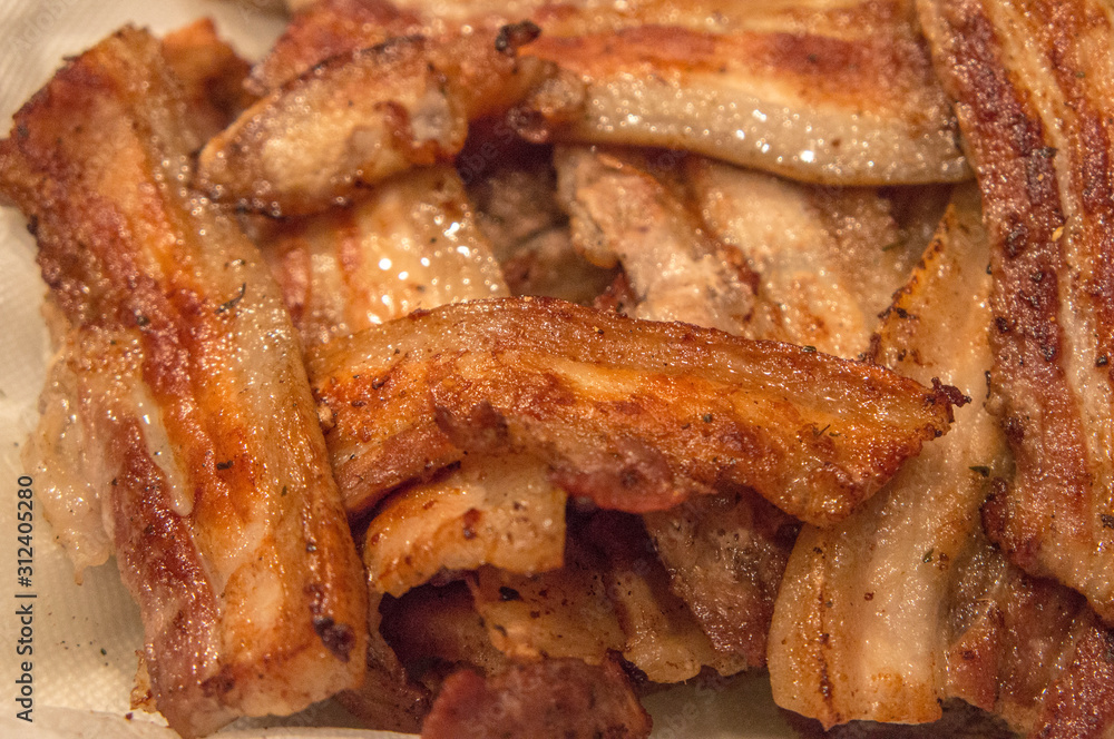 Grilled pork bacon close-up. Fried meat. Grilled pork bacon close-up. Fried meat.