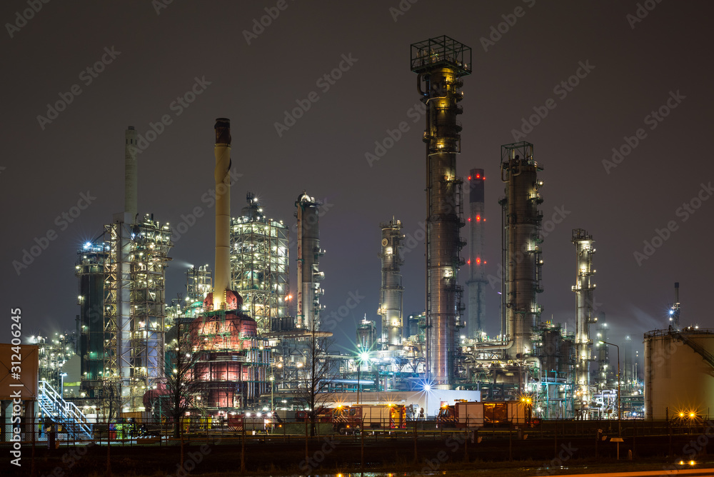 Oil refinery in the port of Rotterdam, Netherlands at night Oil refinery in the port of Rotterdam, Netherlands at night