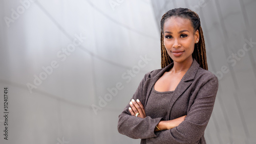 Banner of African American female company leader CEO boss executive standing confident with ambition and pride, at financial 